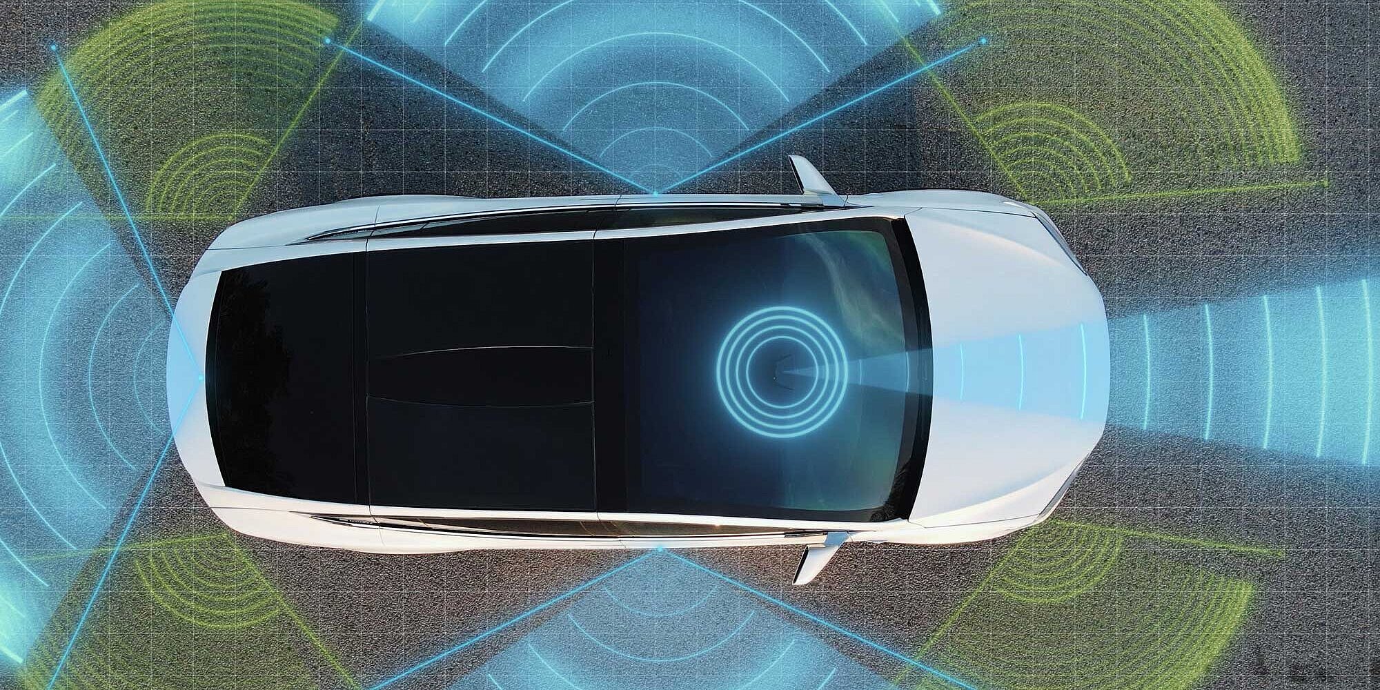 Vista superior de un coche con campos de sensores coloridos para detectar entorno y distancia